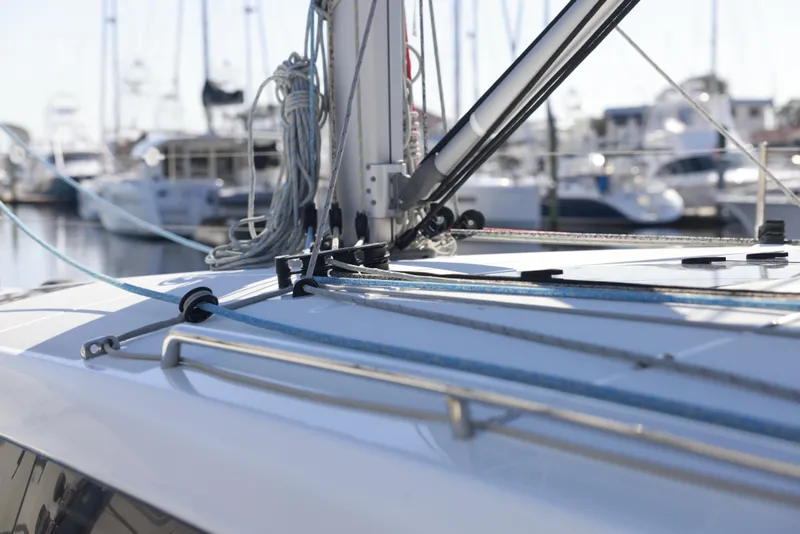 Slide: The Image of Deck view of 2022 Jeanneau Sun Odyssey 410 sailboat in marina. - 1