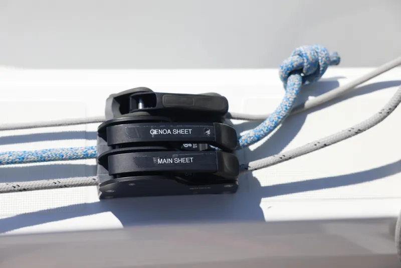 Slide: The Image of Jeanneau Sun Odyssey 410 (2022) sailboat rigging with labeled genoa and main sheet cleats. - 17