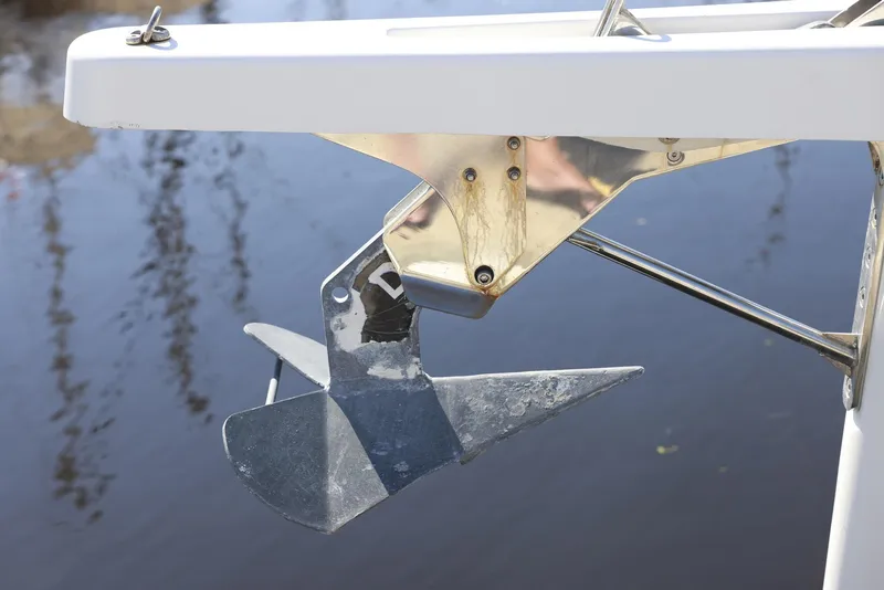 Slide: The Image of Anchor of 2022 Jeanneau Sun Odyssey 410 sailboat, positioned above water. - 22