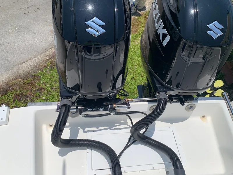 Slide: The Image of Twin Suzuki outboard motors on 2000 Robalo 2640 Walkaround boat. - 13