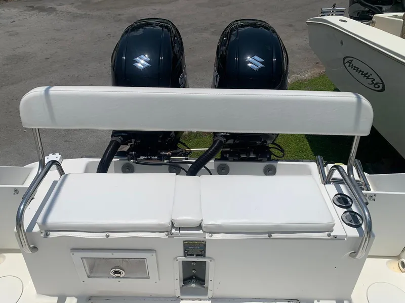 Slide: The Image of 2000 Robalo 2640 Walkaround boat with dual outboard engines, rear seating view. - 20