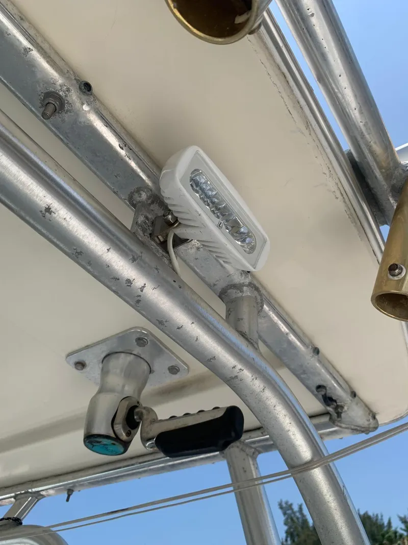 Slide: The Image of Robalo 2640 Walkaround 2000 boat canopy with mounted lights and rod holders. - 21