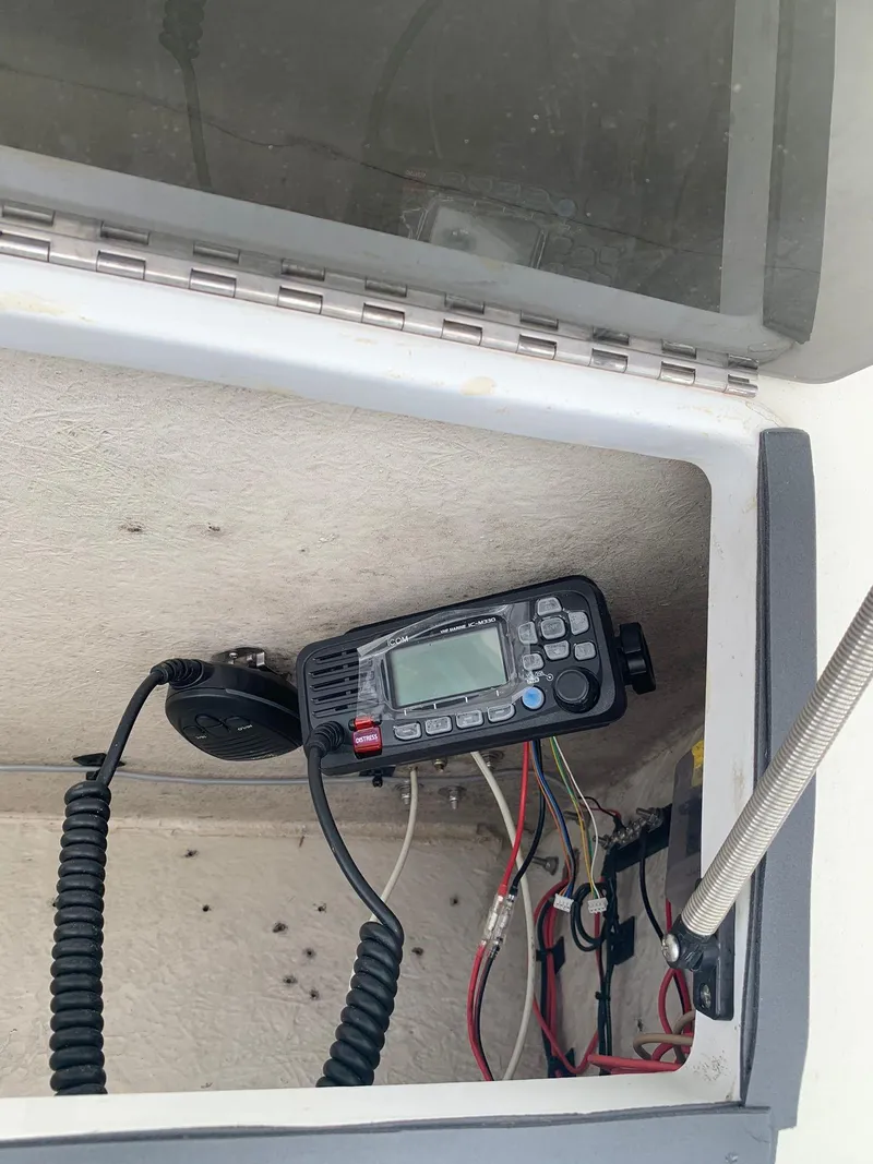 Slide: The Image of VHF radio installed in a 2000 Robalo 2640 Walkaround boat compartment. - 9