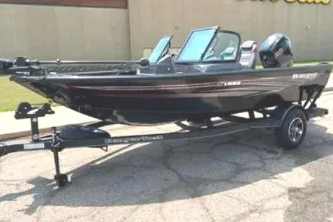 The Image of 2024 Ranger VS1682SC Angler boat on trailer, parked outdoors. - 0