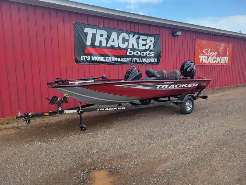 The Image of 2025 Tracker Pro Team 175 Crappie Edition boat displayed outside dealership. - 0