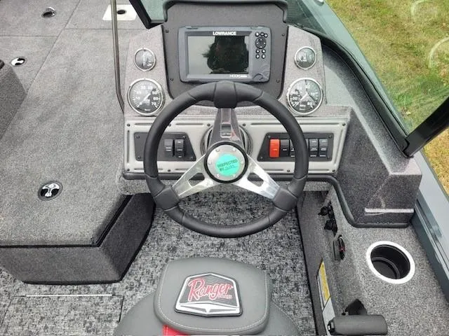 Slide: The Image of 2024 Ranger VS1682SC Angler boat dashboard with steering wheel and navigation system. - 3