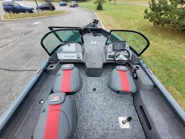 Slide: The Image of 2024 Ranger VS1682SC Angler boat interior with red and gray seating, dashboard, and steering wheel. - 4