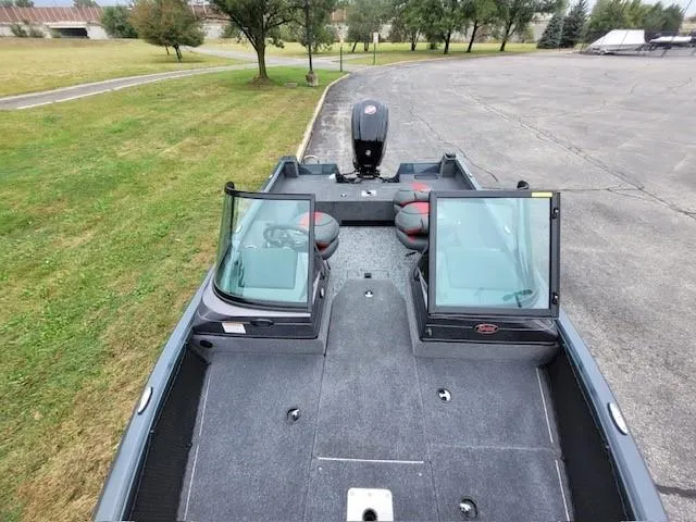 Slide: The Image of 2024 Ranger VS1682SC Angler boat with dual windshields, spacious deck, and outboard motor. - 5