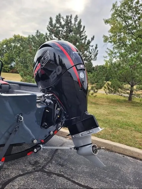 Slide: The Image of 2024 Ranger VS1782SC Angler boat with powerful outboard motor in a scenic outdoor setting. - 2