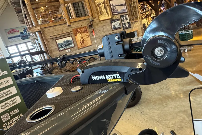 Slide: The Image of 2024 Ranger VS1882SC Angler boat with Minn Kota Terrova motor in rustic showroom. - 71