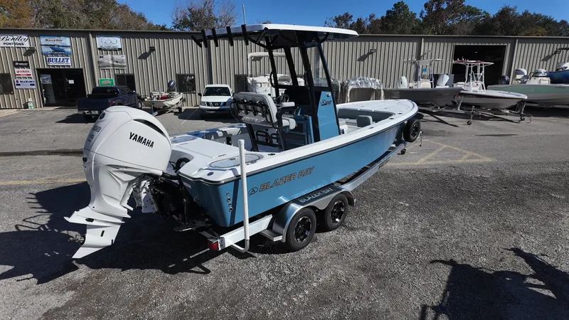 Slide: The Image of 2025 Blazer 2440 boat with Yamaha engine on trailer in parking lot. - 20