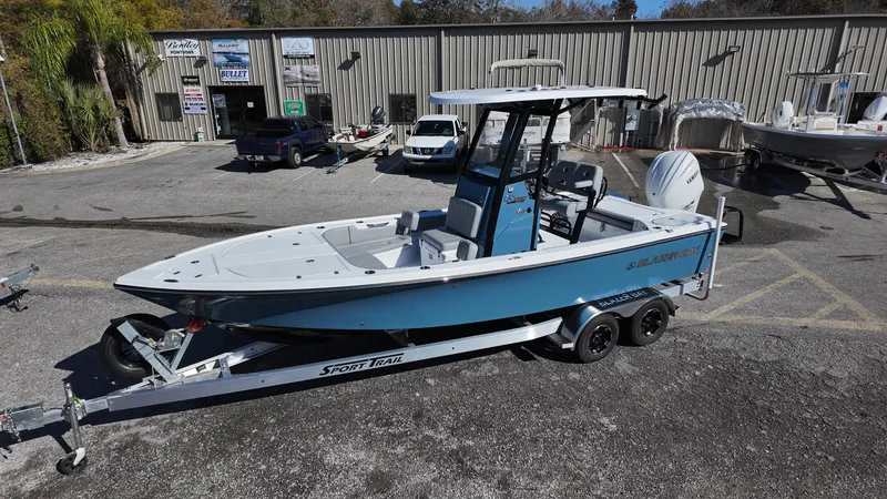 Slide: The Image of 2025 Blazer 2440 boat on trailer in dealership lot, side view. - 34