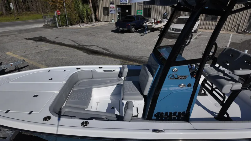 Slide: The Image of 2025 Blazer 2440 boat with sleek seating and modern design in a parking lot. - 48
