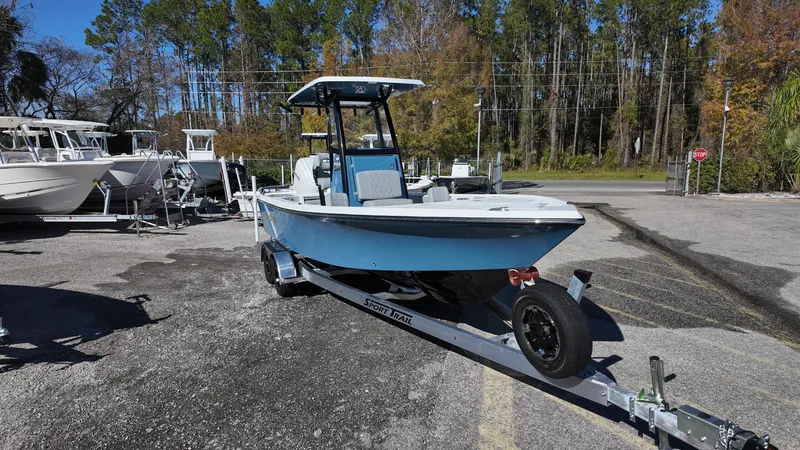 Slide: The Image of 2025 Blazer 2440 boat on trailer in outdoor parking lot. - 5