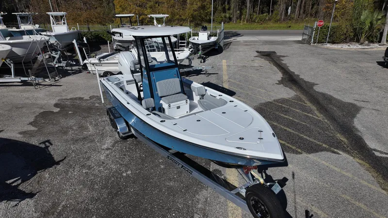 Slide: The Image of 2025 Blazer 2440 boat on trailer in outdoor lot. - 6