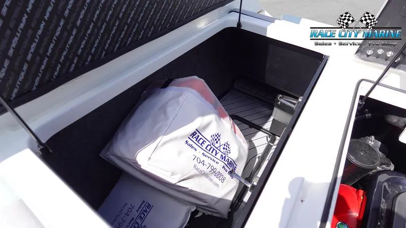 Slide: The Image of 2021 Nautique Super Air Nautique G23 storage compartment with Race City Marine gear. - 19