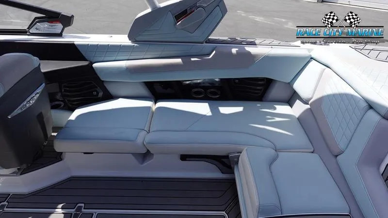Slide: The Image of Interior of 2021 Nautique Super Air Nautique G23 boat with luxurious seating. - 21