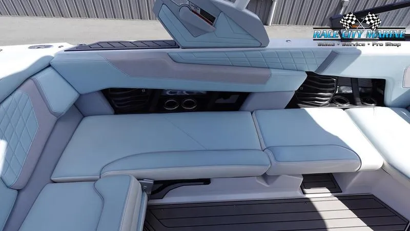 Slide: The Image of 2021 Nautique Super Air Nautique G23 interior with light blue upholstery. - 22