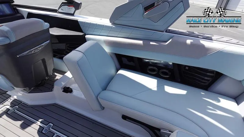 Slide: The Image of 2021 Nautique Super Air Nautique G23 interior with luxurious seating and modern design. - 25