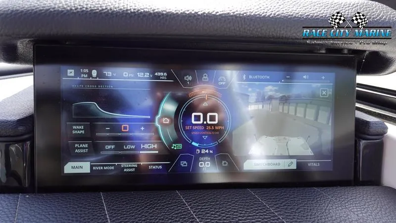 Slide: The Image of 2021 Nautique Super Air Nautique G23 dashboard display with speed and control settings. - 35