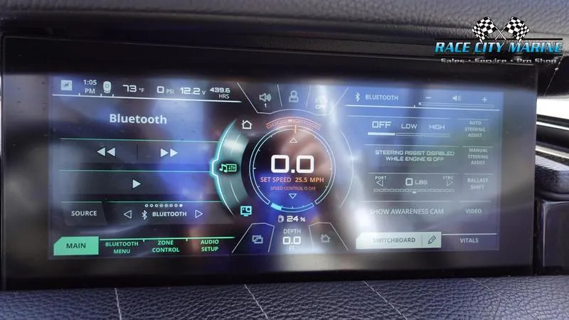 Slide: The Image of 2021 Nautique Super Air Nautique G23 dashboard display with Bluetooth and control settings. - 36