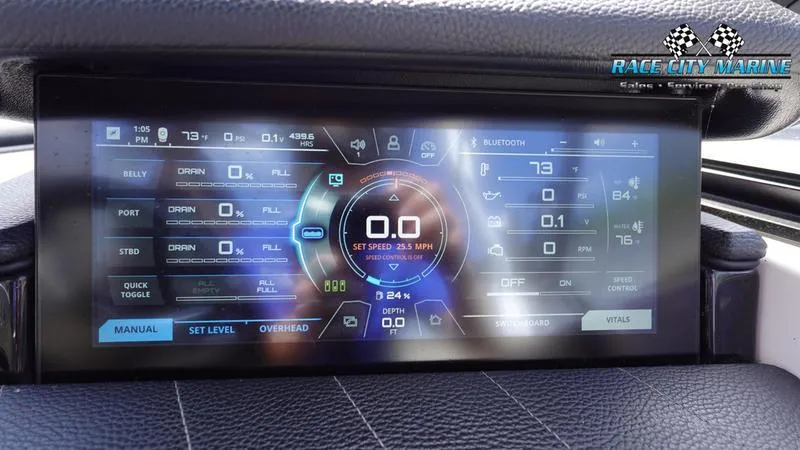 Slide: The Image of Dashboard display of 2021 Nautique Super Air Nautique G23 boat controls. - 37