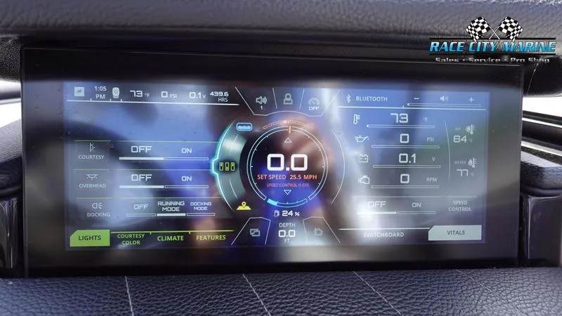 Slide: The Image of 2021 Nautique Super Air Nautique G23 digital dashboard display with speed and control settings. - 38