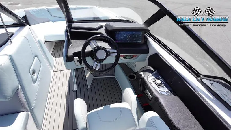 Slide: The Image of 2021 Nautique Super Air Nautique G23 boat interior with modern dashboard and seating. - 41