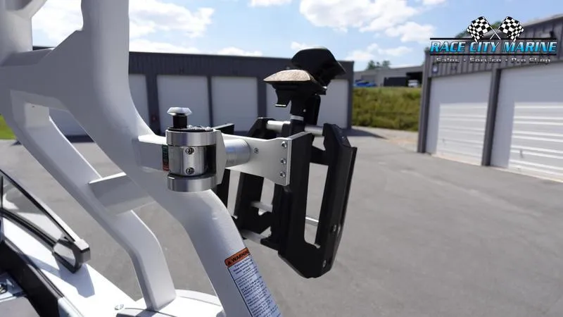 Slide: The Image of 2021 Nautique Super Air Nautique G23 boat accessory detail in a marina setting. - 47