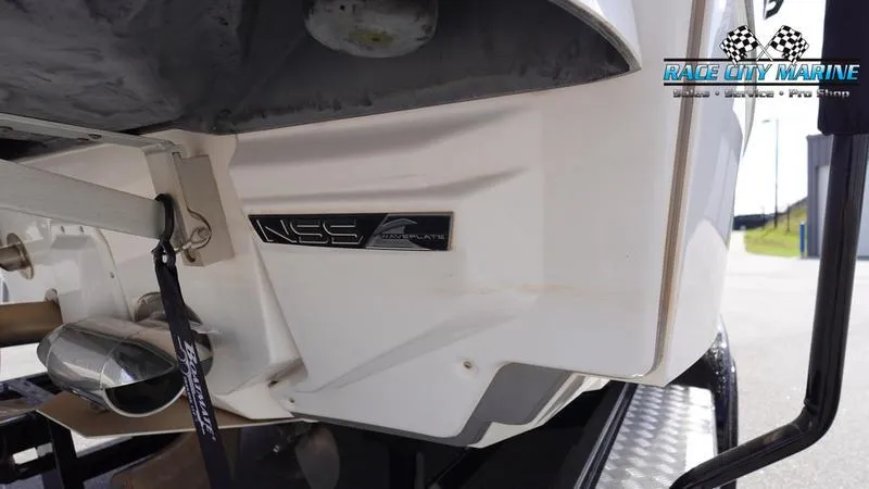 Slide: The Image of 2021 Nautique Super Air Nautique G23 boat rear view with NSS logo. - 9