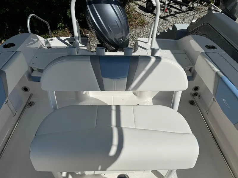 Slide: The Image of 2025 Robalo R200 Center Console boat interior with seating and motor. - 14