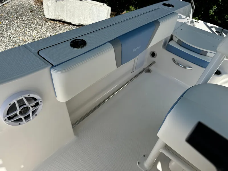 Slide: The Image of 2025 Robalo R200 Center Console boat interior with seating and speaker. - 15