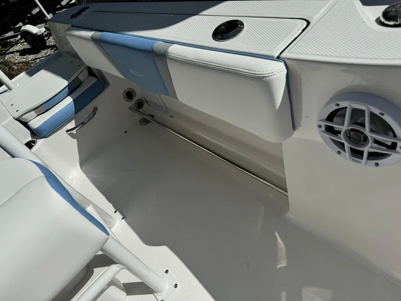 Slide: The Image of 2025 Robalo R200 Center Console interior with seating and speaker detail. - 16