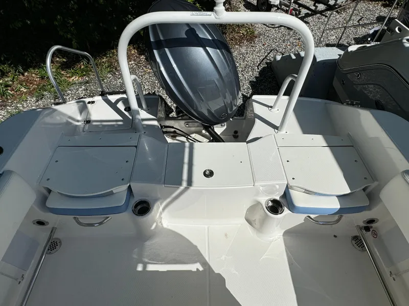 Slide: The Image of 2025 Robalo R200 Center Console boat deck with seating and outboard motor. - 17