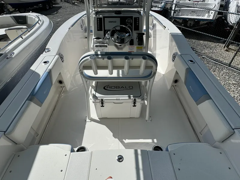 Slide: The Image of 2025 Robalo R200 Center Console boat interior with steering wheel and seating. - 4