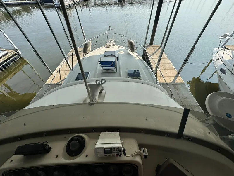 Slide: The Image of 1986 Silverton 34 Convertible yacht docked at marina, view from helm. - 9
