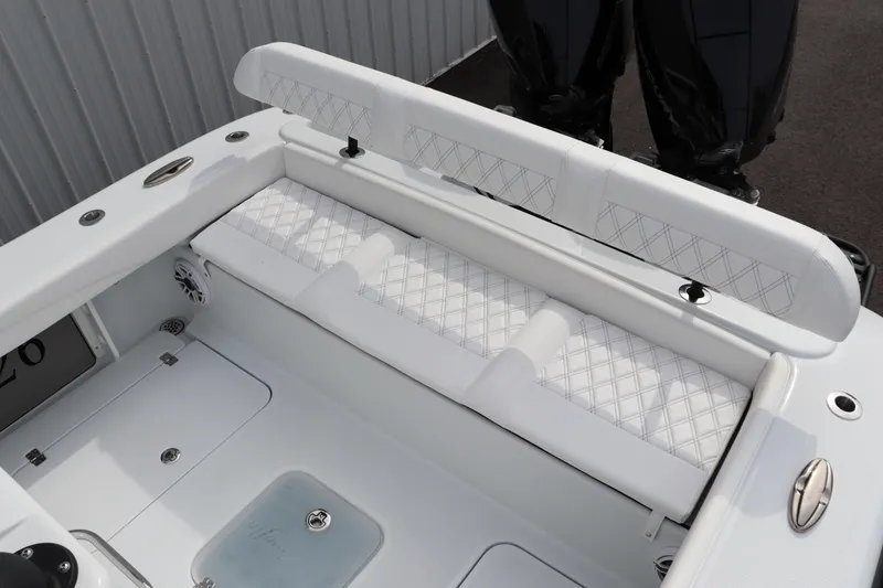 Slide: The Image of 2025 Yellowfin 26 Hybrid boat with white cushioned seating and sleek design. - 12