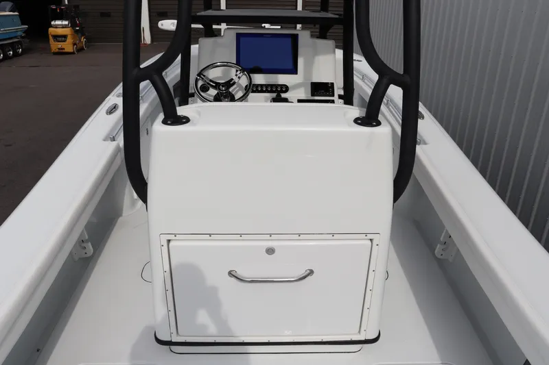 Slide: The Image of 2025 Yellowfin 26 Hybrid boat console with steering wheel and navigation screen. - 13