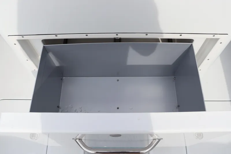Slide: The Image of Open storage compartment on 2025 Yellowfin 26 Hybrid boat. - 16