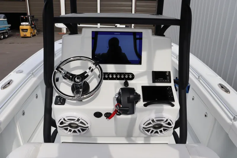 Slide: The Image of 2025 Yellowfin 26 Hybrid boat console with steering wheel and electronic displays. - 17