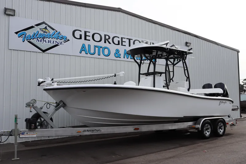 Slide: The Image of 2025 Yellowfin 26 Hybrid boat on trailer at Georgetown Auto & Marine. - 2