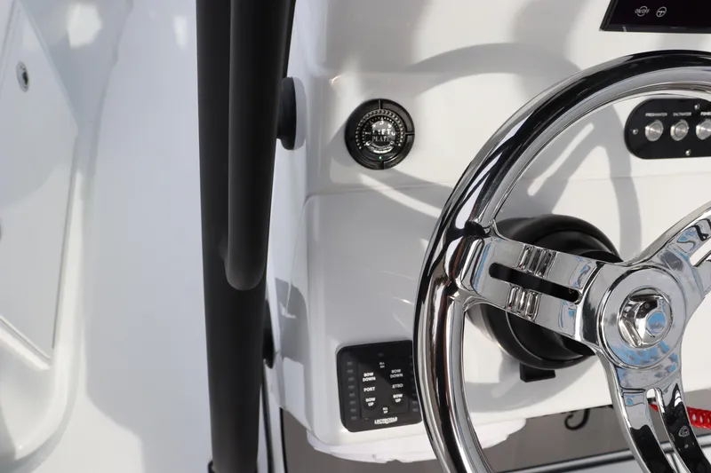 Slide: The Image of 2025 Yellowfin 26 Hybrid boat steering wheel and control panel. - 21