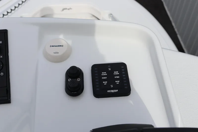 Slide: The Image of Control panel of 2025 Yellowfin 26 Hybrid boat with electronic controls. - 29