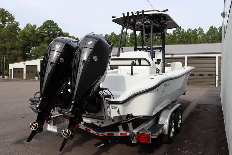 Slide: The Image of 2025 Yellowfin 26 Hybrid boat with dual engines on a trailer. - 4