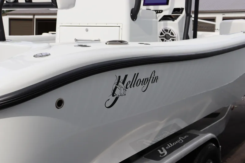 Slide: The Image of 2025 Yellowfin 26 Hybrid boat, sleek white design with logo detail. - 5