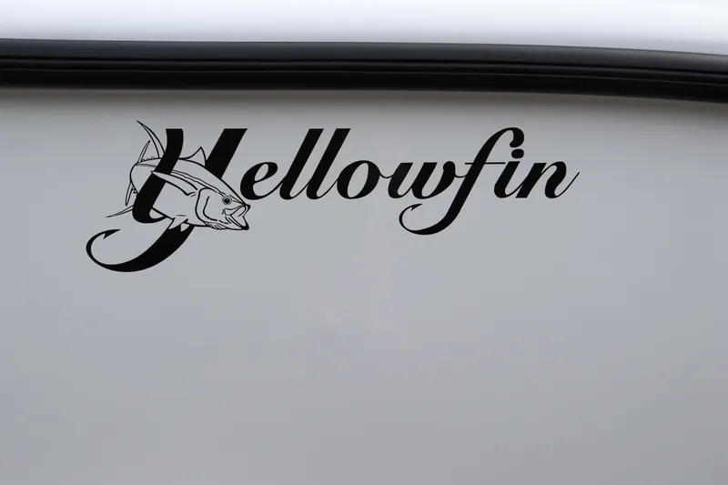 Slide: The Image of Yellowfin 26 Hybrid 2025 logo on boat exterior with fish illustration. - 6