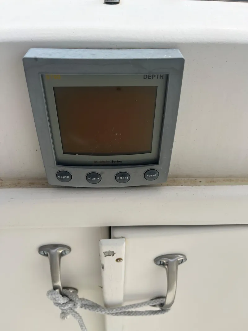 Slide: The Image of Depth gauge on 1985 Hatteras 45 Convertible boat dashboard. - 16