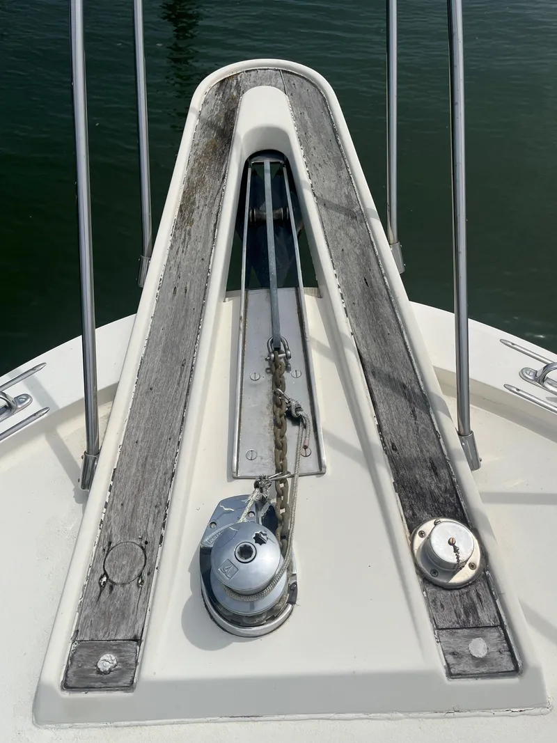 Slide: The Image of Bow of 1985 Hatteras 45 Convertible yacht with anchor chain and winch. - 17