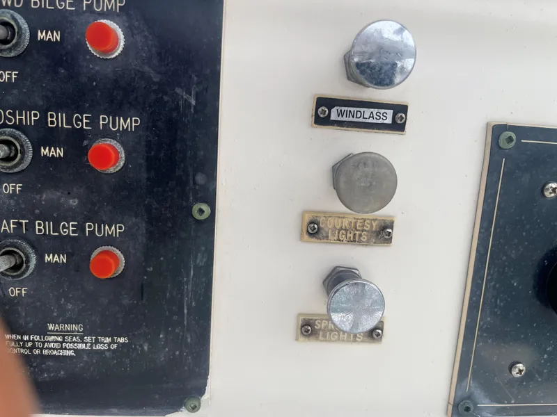 Slide: The Image of Control panel of a 1985 Hatteras 45 Convertible boat with bilge pump switches. - 19