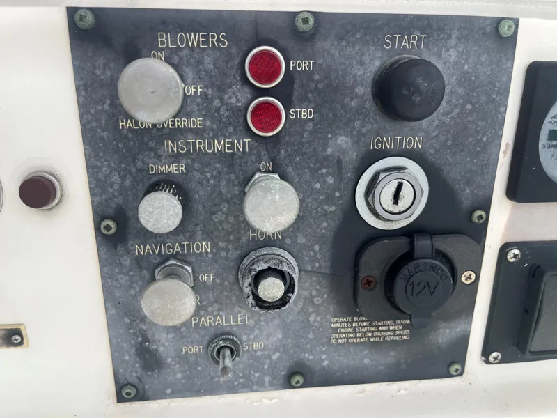 Slide: The Image of Control panel of a 1985 Hatteras 45 Convertible boat with ignition and navigation switches. - 20